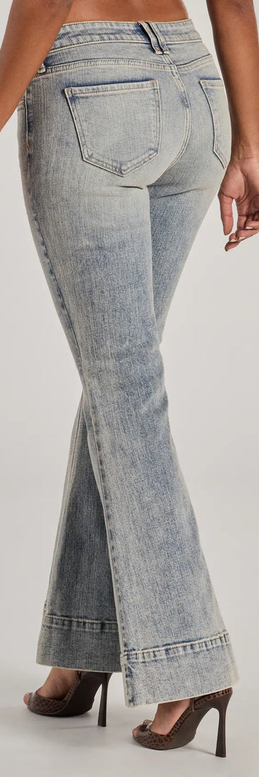 The So Fab Mid-Rise Flared Tinted Wash Denim Jeans is a trendy women's bottom in light blue, designed with modern details and alluring textures to complete chic outfits for 2025.