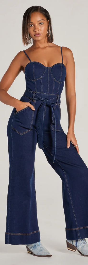The New Era Sweetheart Flare Denim Jumpsuit is a stylish women's denim jumpsuit, perfect for creating easy winter outfits, from casual days to seasonal gatherings.