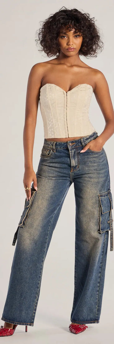 The Trendsetter High-Rise Wide-Leg Cargo Jeans is a trendy women's bottom in dark denim wash, designed with modern details and alluring textures to complete chic outfits for 2025.