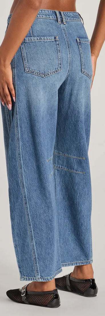 The The Classic Mid-Rise Barrel Leg Denim Jeans is a trendy women's bottom in dark denim wash, designed with modern details and alluring textures to complete chic outfits for 2025.