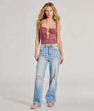The Effortlessly Casual High-Rise Distressed Dad Jeans is a pair of stylish women's denim pants, perfect for creating easy winter outfits, from casual days to seasonal gatherings.