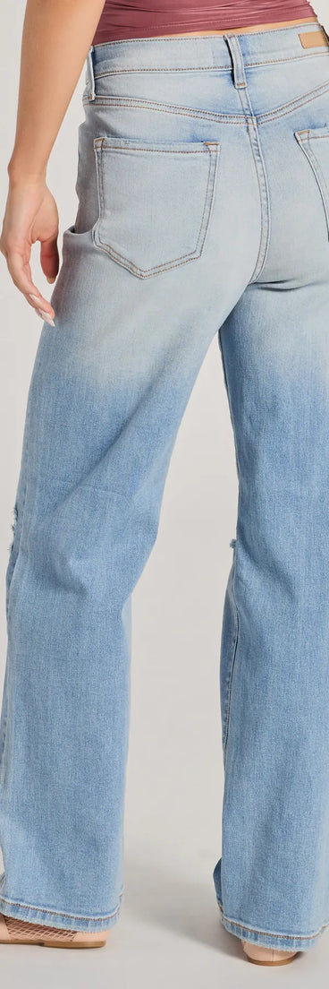 The Effortlessly Casual High-Rise Distressed Dad Jeans is a trendy women's bottom in light blue, designed with modern details and alluring textures to complete chic outfits for 2025.