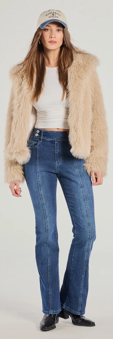 The Good Vibes Mid-Rise Flared Denim Jeans is a trendy women's bottom in dark denim wash, designed with modern details and alluring textures to complete chic outfits for 2025.