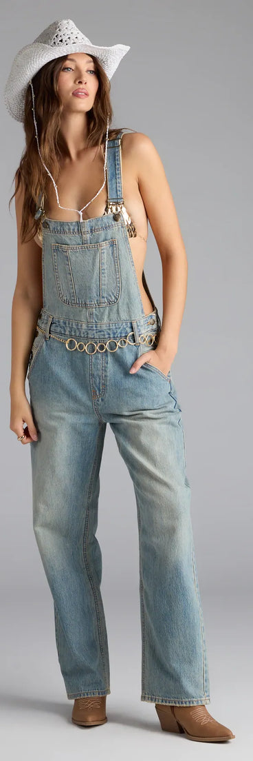 Complete your transitional-weather wardrobe with the Casual Babe Tinted Denim Overalls, trendy bottoms in medium denim wash made to mix, match, and stand out.