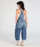 Create bold, fashion-forward looks for spring or summer with the Match My Vibe Wide-Leg Denim Overalls in denim blue, a must-have piece from Windsor’s collection of stylish bottoms for women.