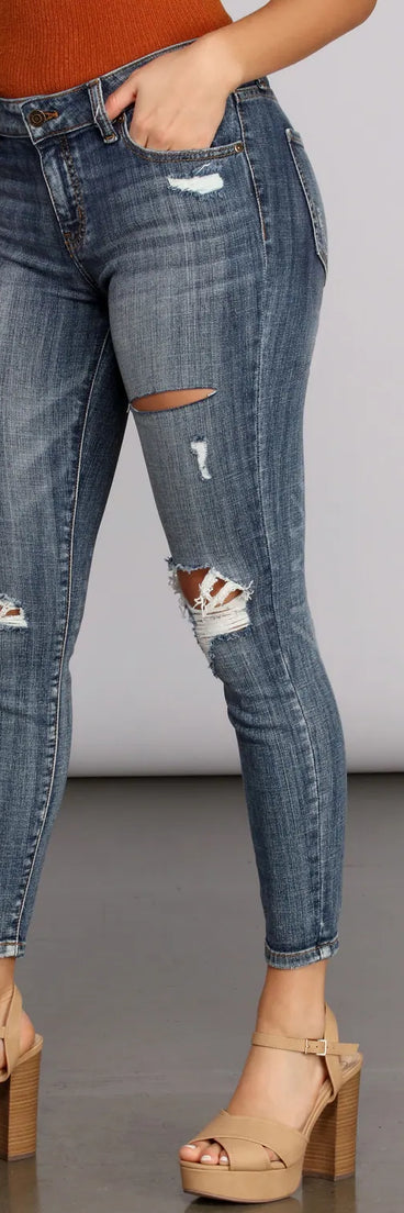 Josie Mid Rise Destructed Skinny Jeans