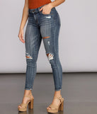 Josie Mid Rise Destructed Skinny Jeans
