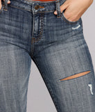 Josie Mid Rise Destructed Skinny Jeans