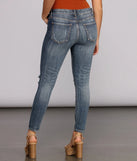 Josie Mid Rise Destructed Skinny Jeans