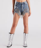 The On The Fringe Rhinestone Denim Shorts is a trendy women's bottom in medium denim wash, designed with modern details and alluring textures to complete chic outfits for 2025.
