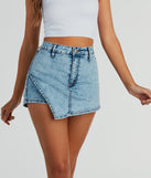 The Center Stage High-Rise Acid Denim Skort is a trendy women's bottom in light blue, designed with modern details and alluring textures to complete chic outfits for 2025.