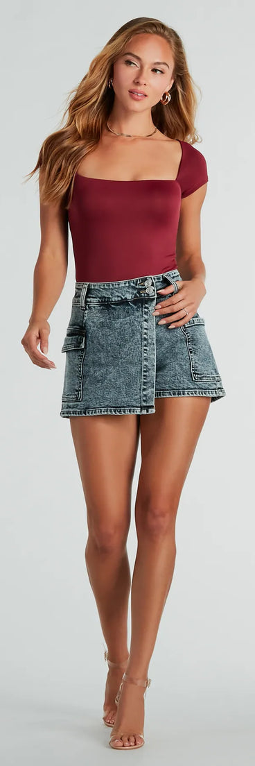 The Trendy Impression Acid-Wash Denim Wrap Skort is a trendy women's bottom in dark denim wash, designed with modern details and alluring textures to complete chic outfits for 2025.