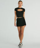With the convenience of shorts and the look of a skirt, the Trendsetting Era High-Rise Faux Wrap Cargo Denim Skort in black is a must-have for fashionable winter layers and versatile holiday styling.