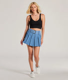 Create bold, fashion-forward looks for spring or summer with the Casual Darling High-Rise Belted Pleated Denim Skort in medium denim wash, a must-have piece from Windsor’s collection of stylish bottoms for women.