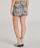 The Cute Effect Mid-Rise Belted Denim Mini Skort in denim blue brings edge and energy to your vibe, ready to elevate any festival look or concert outfit.