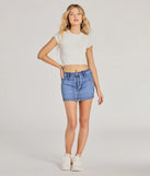 Get the look of a skirt and the comfort of shorts in the Total Perfection Mid Rise Denim Mini Skort in dark denim wash, perfect for staying stylish while on the move this summer.