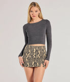 The Elevated Edgy Snake Print Denim Mini Skort is a trendy women's bottom in snake print, designed with modern details and alluring textures to complete chic outfits for 2025.