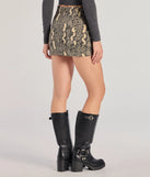 The Elevated Edgy Snake Print Denim Mini Skort is a trendy women's bottom in snake print, designed with modern details and alluring textures to complete chic outfits for 2025.