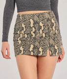The Elevated Edgy Snake Print Denim Mini Skort is a trendy women's bottom in snake print, designed with modern details and alluring textures to complete chic outfits for 2025.