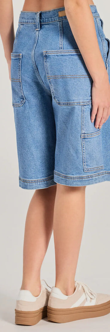 The Latest Trend Mid-Rise Denim Jorts is a trendy women's bottom in medium denim wash, designed with modern details and alluring textures to complete chic outfits for 2025.