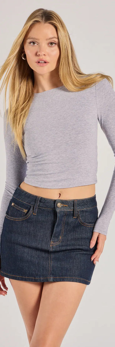 The Classic Staple Denim Mini Skort is a trendy women's bottom in dark denim wash, designed with modern details and alluring textures to complete chic outfits for 2025.