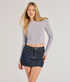 The Classic Staple Denim Mini Skort is a trendy women's bottom in dark denim wash, designed with modern details and alluring textures to complete chic outfits for 2025.