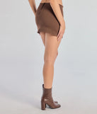 The Casual Look Denim Mini Skort is a trendy women's bottom in brown, designed with modern details and alluring textures to complete chic outfits for 2025.