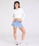 The Talk About Me Mid-Rise Pleated Denim Skort in medium denim wash brings edge and energy to your vibe, ready to elevate any festival look or concert outfit.