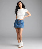 Choosing the medium denim wash skort says you’re ready to show off in the Timeless Staple Mid-Rise Button Denim Skort, a warm-weather staple that elevates your outfit and seasonal style.