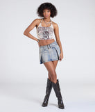 Create bold, fashion-forward looks for spring or summer with the Such A Cinch Mid-Rise Belted Denim Skort in denim blue, a must-have piece from Windsor’s collection of stylish bottoms for women.