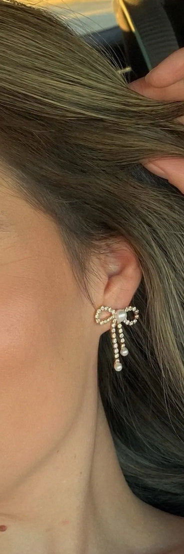 Get inspired with the Perfect Glamour Faux Pearl Rhinestone Bow Earrings, a feed-worthy gold piece that’s part of Windsor's updated and curated women’s clothing edit packed with must-have fall outfit ideas.