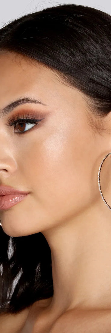 The Stunning Sparkle Large Hoop Earrings in gold is an elevated pick for your best outfit yet, effortlessly delivering a polished look that's sure to turn heads at any celebration.