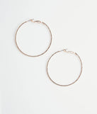 The Tiny & Textured Shimmer Hoops in gold is an elevated pick for your best outfit yet, effortlessly delivering a polished look that's sure to turn heads at any celebration.