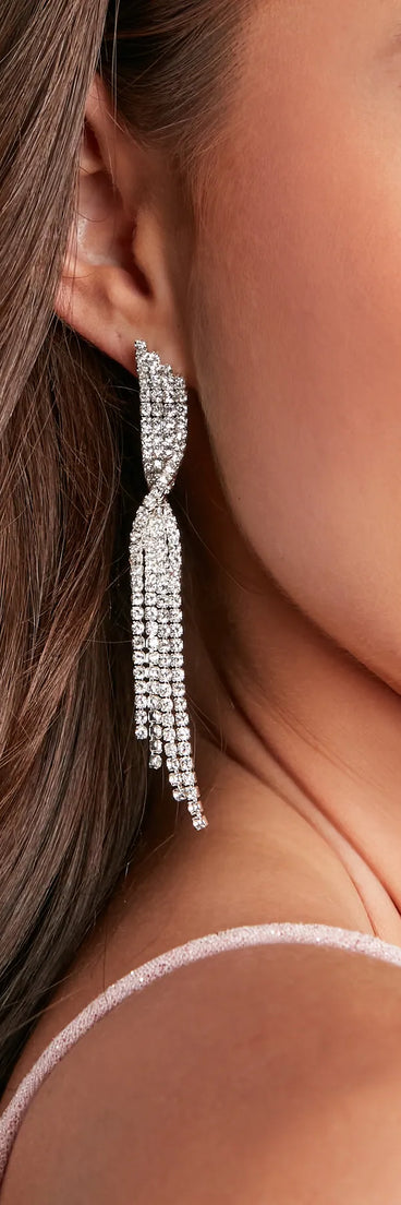 Turn heads at Prom 2025 in this silver prom dress, where statement-making details meet the iconic style of the Twisted Rhinestone Dusters.