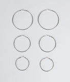 The Essential Three-Pack Hoop Earrings Set in silver is a women's workwear essential with an elevated fabric and chic silhouette, ideal for layering and versatile enough to take your look from office chic to going-out ready!