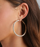 The Beautiful Sparkle Rhinestone Hoop Earrings in gold brings edge and energy to your vibe, ready to elevate any festival look or concert outfit.