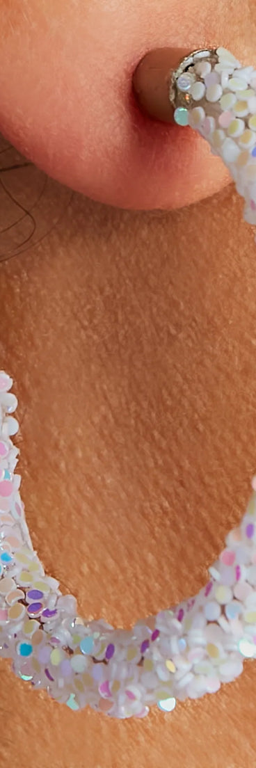 The Glowing Nights Iridescent Hoop Earrings is an elevated pick for your best outfit yet, effortlessly delivering a polished look that's sure to turn heads at any celebration.