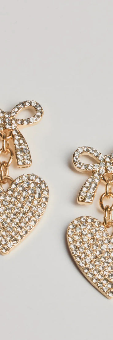 Get ready for any event with the Whimsy Charm Rhinestone Bow And Heart Earrings in gold, an essential start to creating a versatile holiday outfit for women for holiday parties, cocktail hours, or NYE events.