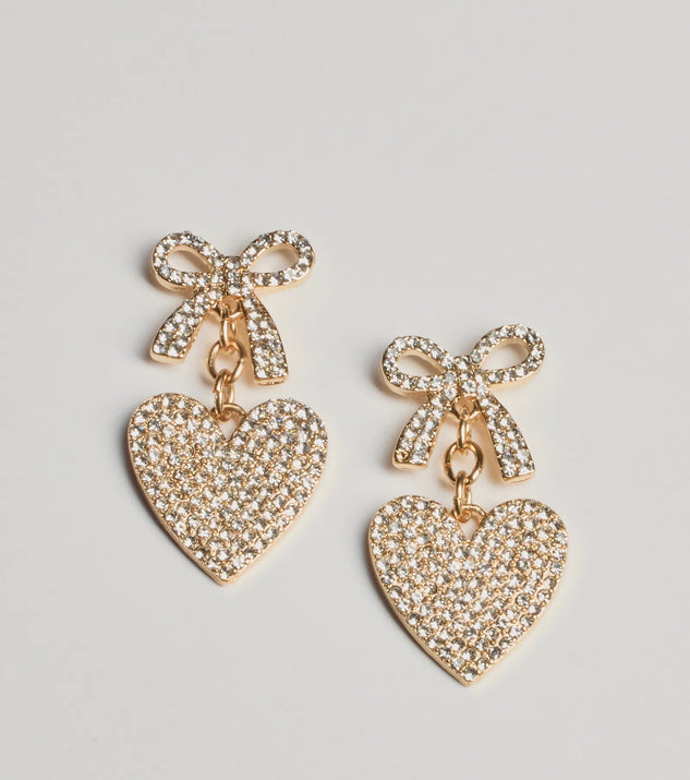 Get ready for any event with the Whimsy Charm Rhinestone Bow And Heart Earrings in gold, an essential start to creating a versatile holiday outfit for women for holiday parties, cocktail hours, or NYE events.