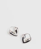 Whether you're dressing up for a romantic date or a Galentine's event, the Weekend Addition Heart Earrings in silver are the perfect accessory to elevate your Valentine's Day outfit.