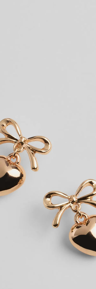 Whether you're dressing up for a romantic date or a Galentine's event, the Poised Heart Bow Earrings in gold are the perfect accessory to elevate your Valentine's Day outfit.