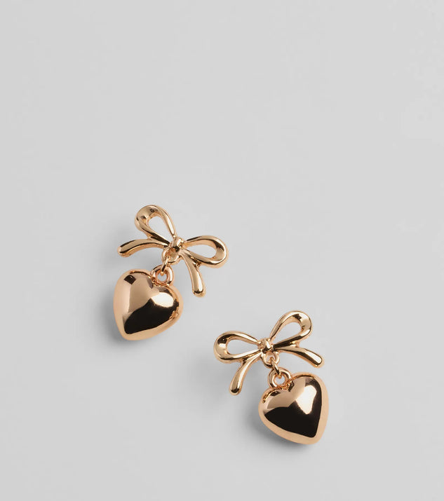 Whether you're dressing up for a romantic date or a Galentine's event, the Poised Heart Bow Earrings in gold are the perfect accessory to elevate your Valentine's Day outfit.