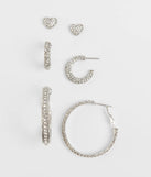 Stay on-trend this season with the Delicate Heart Stud And Hoop Earrings Set in silver, a must-have for creating stylish and effortless spring outfits for women.