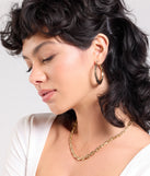 Stay on-trend this season with the Favorite Addition Three-Pack Hoop Earrings in gold, a must-have for creating stylish and effortless spring outfits for women.