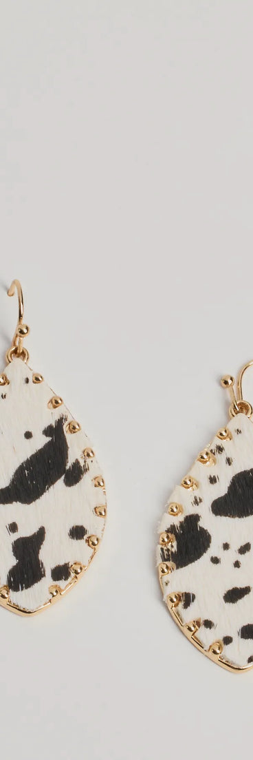The Country Chic Cow Print Teardrop Earrings in multi-color brings edge and energy to your vibe, ready to elevate any festival look or concert outfit.