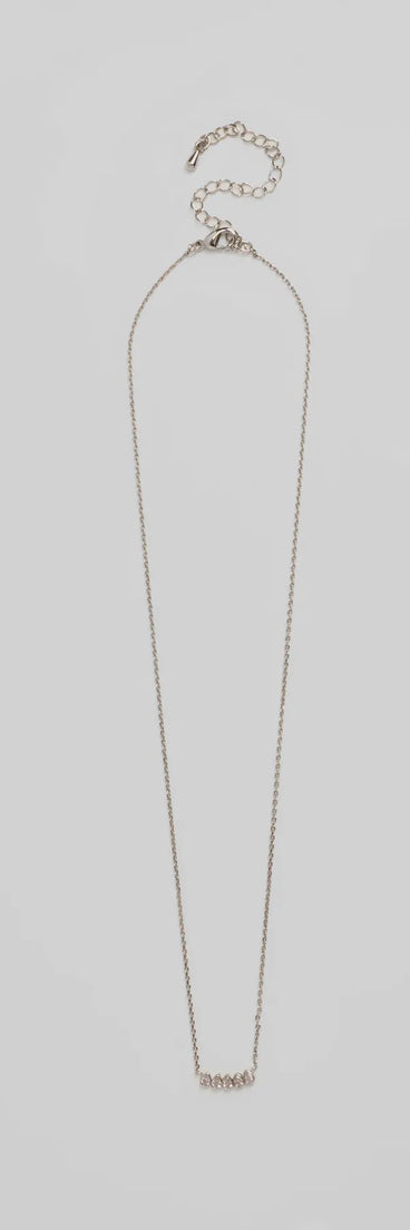 The Perfectly Pretty Cubic Zirconia Necklace helps create a chic silver women's cocktail outfit with a trendy texture and stylish design, ideal for wedding guest cocktail outfits or dinner parties.