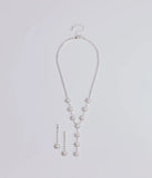 The Truly Glam Rhinestone and Pearl Lariat Necklace Set helps create a chic silver women's cocktail outfit with a trendy texture and stylish design, ideal for wedding guest cocktail outfits or dinner parties.