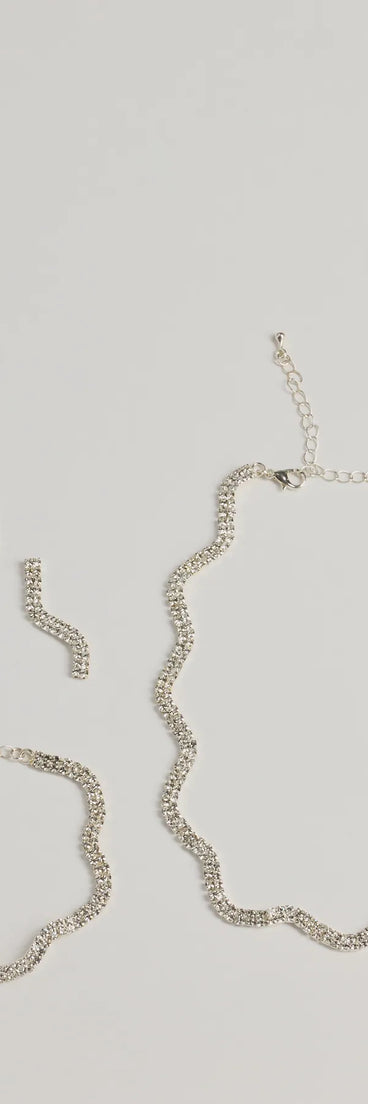 Get ready for any event with the Shine On Wavy Rhinestone Necklace, Earrings, And Bracelet Set in silver, an essential start to creating a versatile outfit for women for parties, cocktail hours, or Valentine's Day events.