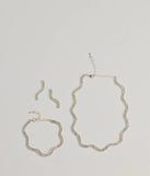 Get ready for any event with the Shine On Wavy Rhinestone Necklace, Earrings, And Bracelet Set in silver, an essential start to creating a versatile outfit for women for parties, cocktail hours, or Valentine's Day events.