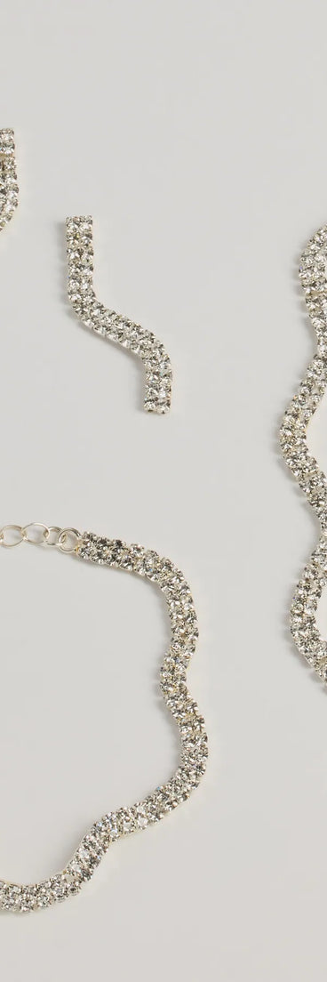 Get ready for any event with the Shine On Wavy Rhinestone Necklace, Earrings, And Bracelet Set in silver, an essential start to creating a versatile outfit for women for parties, cocktail hours, or Valentine's Day events.